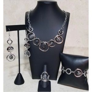 New. 4 pc set. Necklace bracelet earrings & ring.